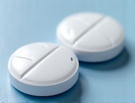 Round white Furosemide (Lasix) tablets with a scored line and DLI imprint